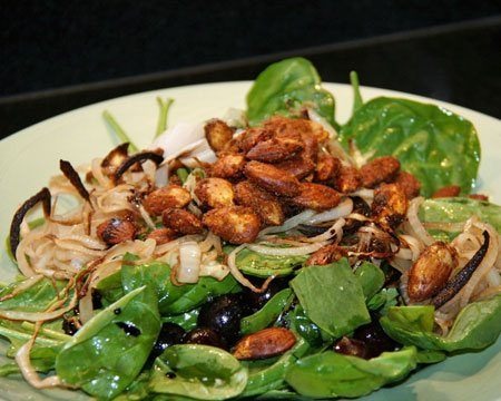 Spinach Salad with Caramelized Onions, Roasted Grapes, and Spiced Almonds Recipe