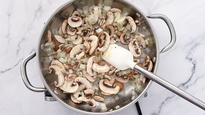 mushrooms and onion in pan