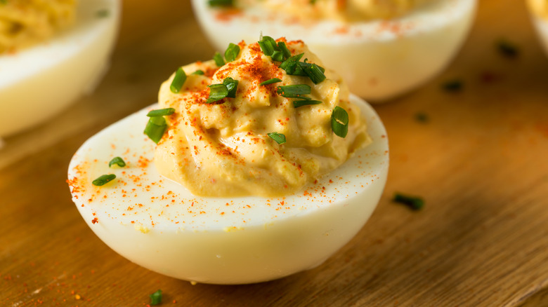 Deviled egg on wooden board