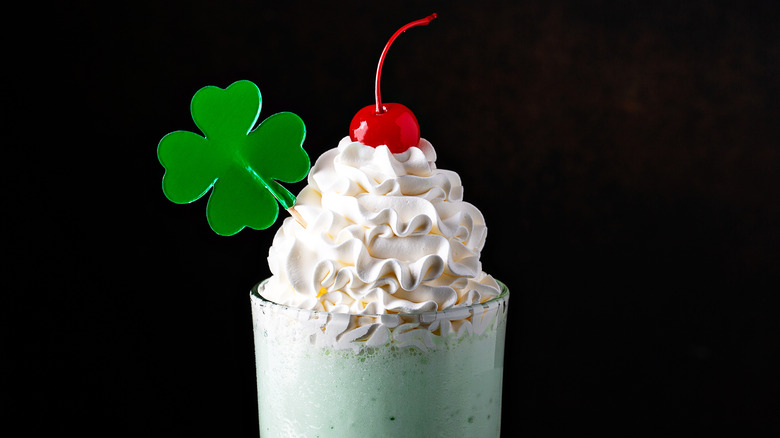 green milkshake with whipped cream