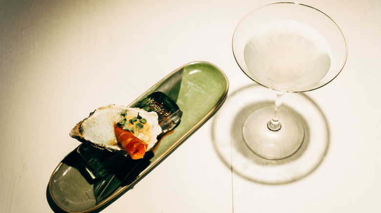 oyster on ice with martini