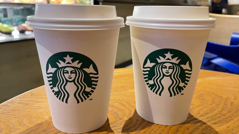 Two Starbucks to-go cups