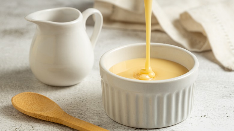 sweetened condensed milk in white container