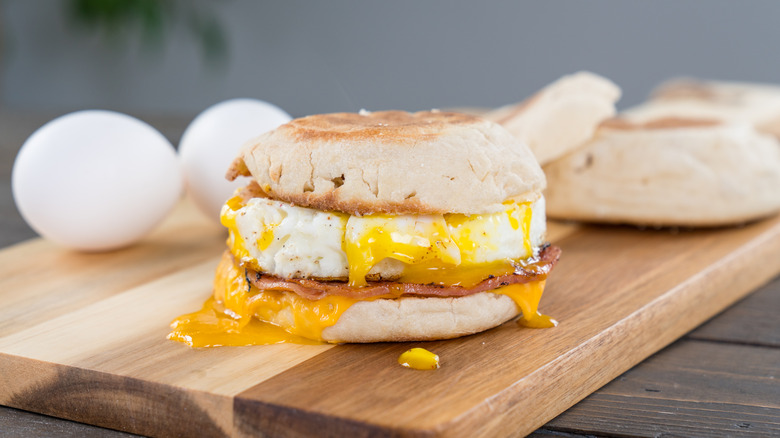 Breakfast sandwich on cutting board