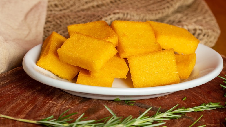 Polenta croutons on plate