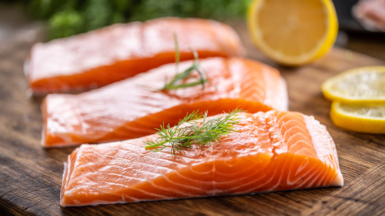 salmon filets on a cutting board