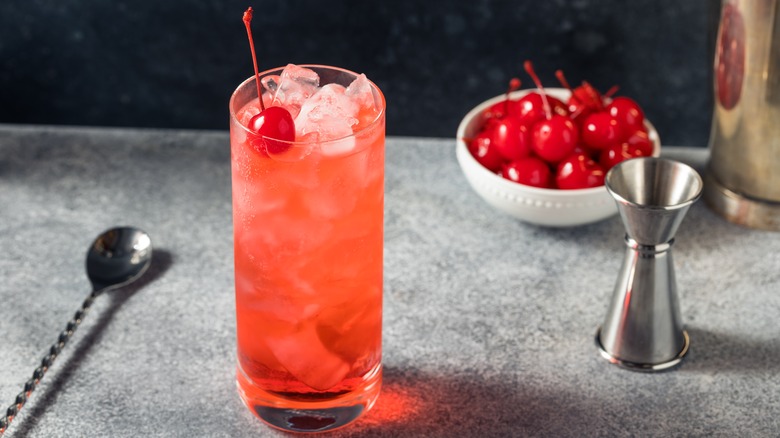 A Dirty Shirley cocktail with cherry garnish