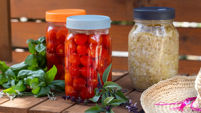 Mason jars with plastic lids containing food