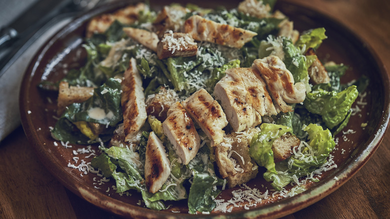 chicken caesar salad in dish