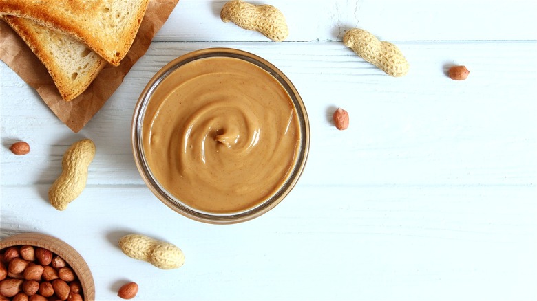 Jar of peanut butter with toast