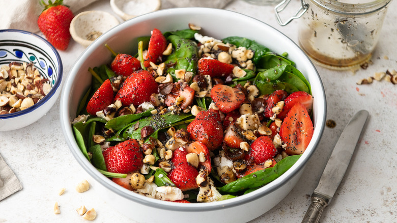 strawberry spinach salad in bowl 