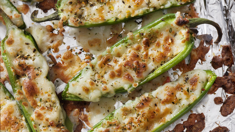 Jalapeno poppers showing cheese and bacon bits