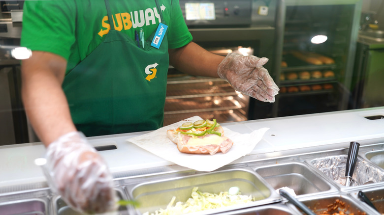 Subway employee making a sandwich