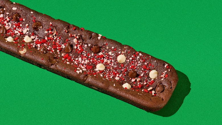 green background with footlong Subway holiday cookie