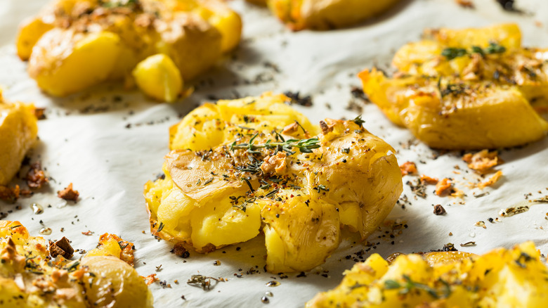 smashed potatoes garnished with rosemary