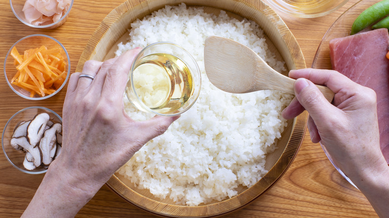 Person making sushi rice