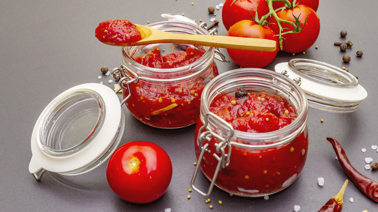 Jars of tomato jam with spoon