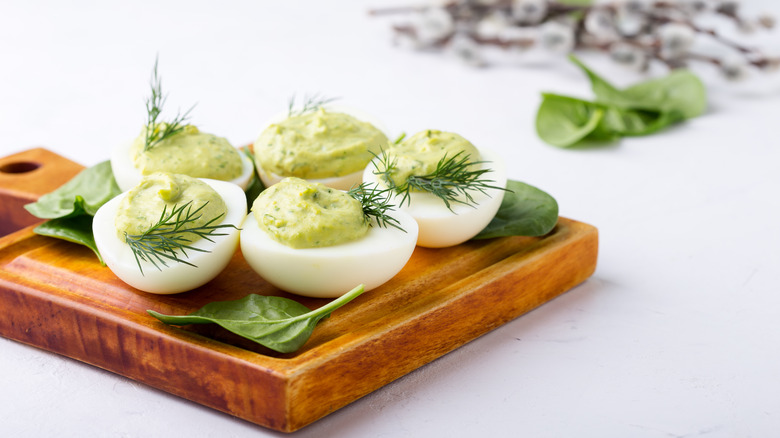 Deviled eggs with avocado and spinach