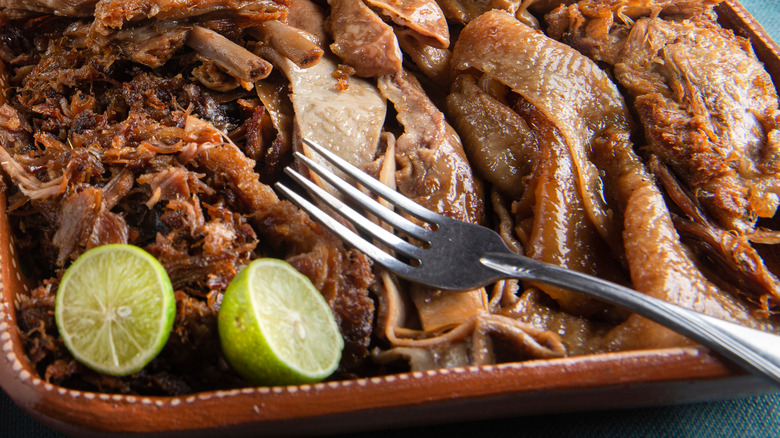 Shredded pork carnitas on tray