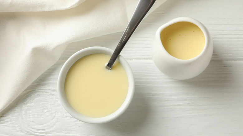 Bowl of condensed milk with spoon