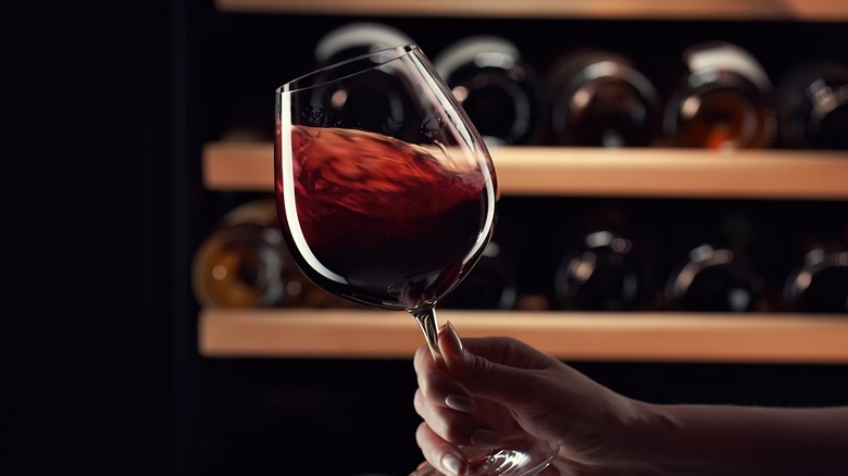 Person swirling wine