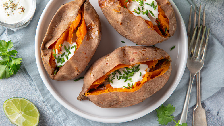 Baked sweet potatoes topped with yogurt