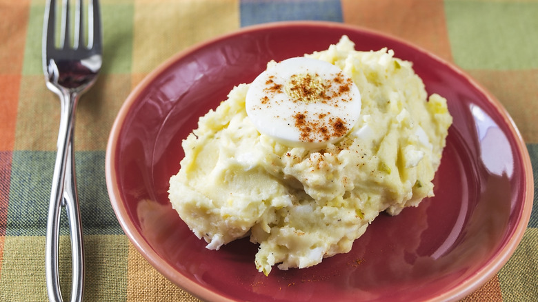 Mashed potato salad with egg slice