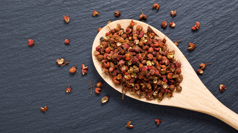 Szechuan peppercorns in a wooden spoon