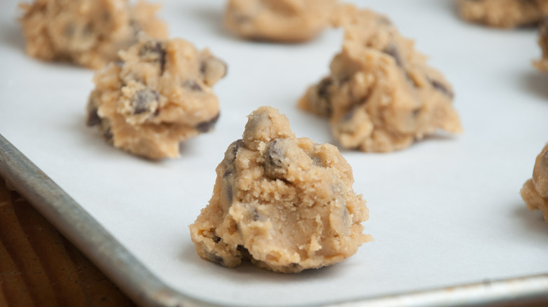 Chocolate chip cookie dough balls on a pan