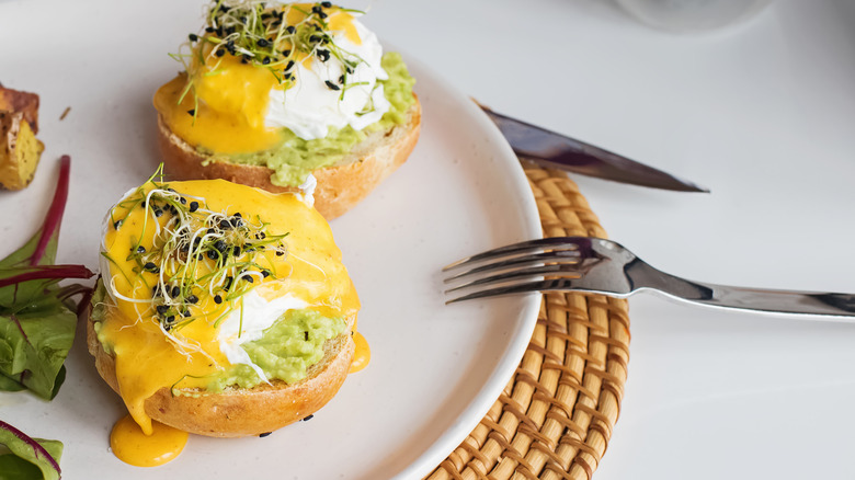 mashed avocado with eggs Benedict