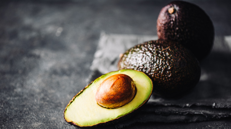 Close up of three avocados