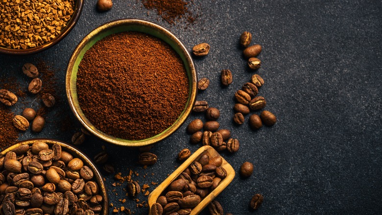 ground coffee, coffee beans, and instant coffee in bowls