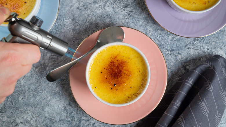 cook torching crème brûlée