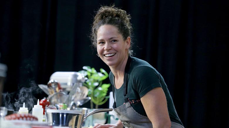 Stephanie Izard cooking and smiling