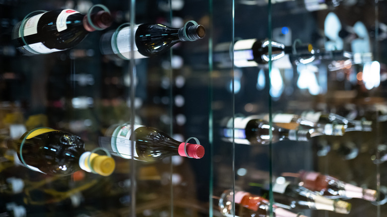 wine stored in a clear shelving unit