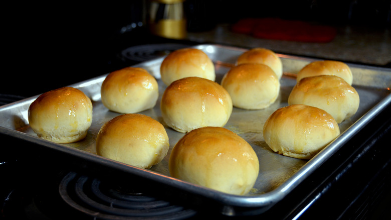 dinner rolls on a baking sheet in the oven