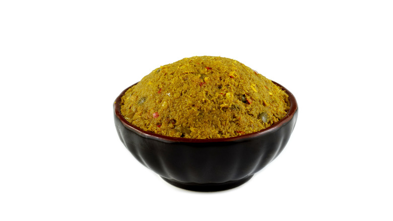 a bowl of yellow curry paste