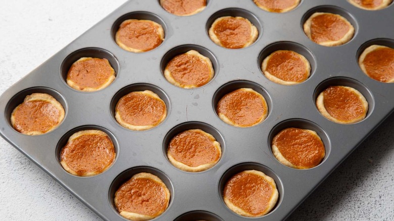 Baked tart shells with pumpkin pie filling