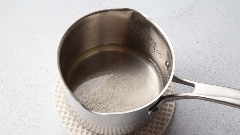 Clear liquid in a metal pot