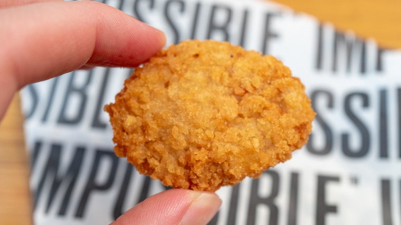 holding Impossible chicken nugget