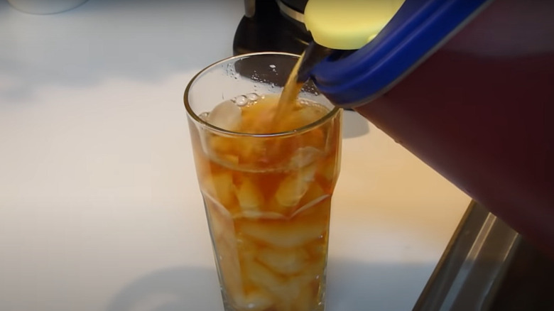 Sweet tea poured from pitcher