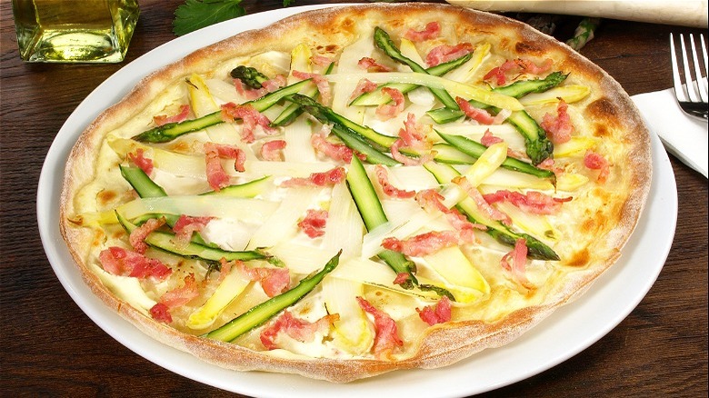 Pizza topped with asparagus ribbons