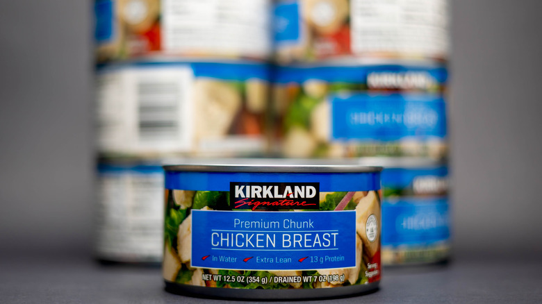 Canned chicken breast on blurry background