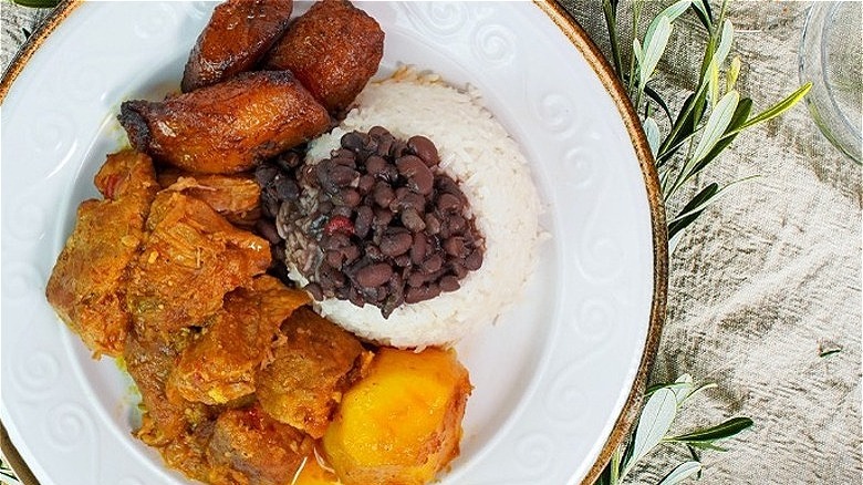 rice, beans, plantains, and pork