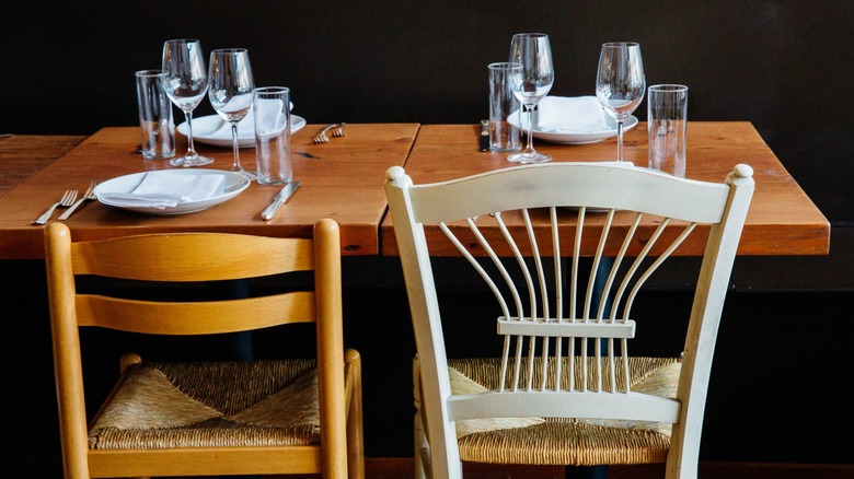 Table setting and chairs at Spinasse Seattle