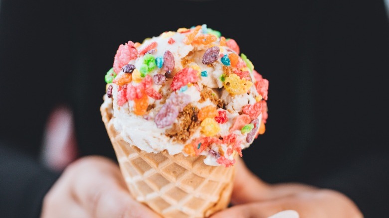 Ice cream cone with cereal on top