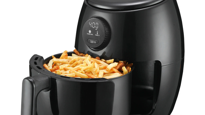 Air fryer filled with French fries