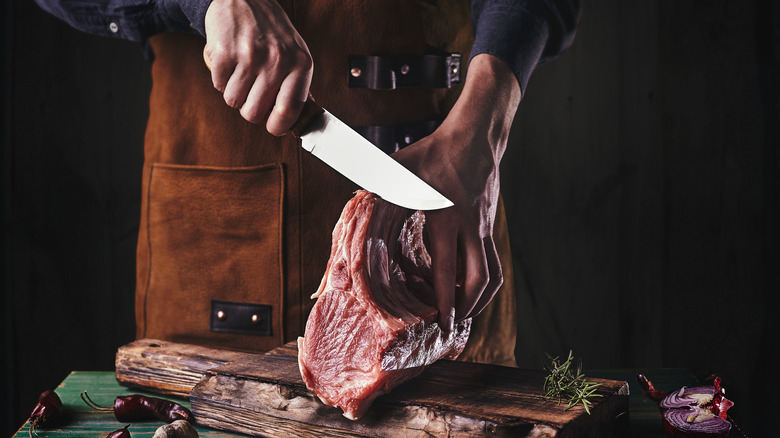 cutting rib roast with knife