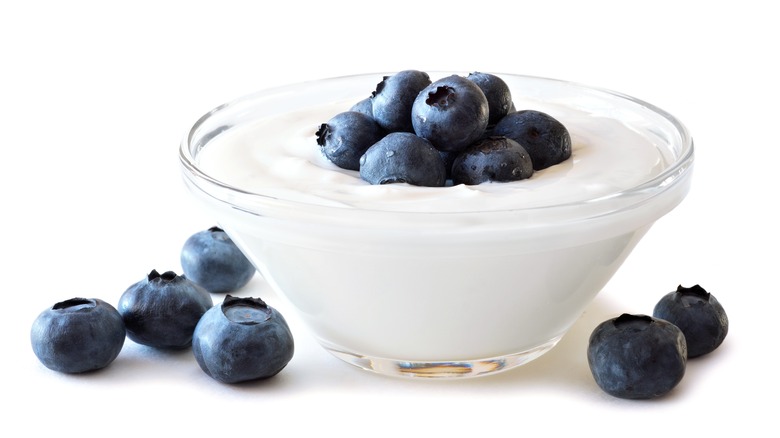 Glass of yogurt and blueberries