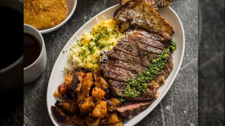 Steak, eggs, and sides plated